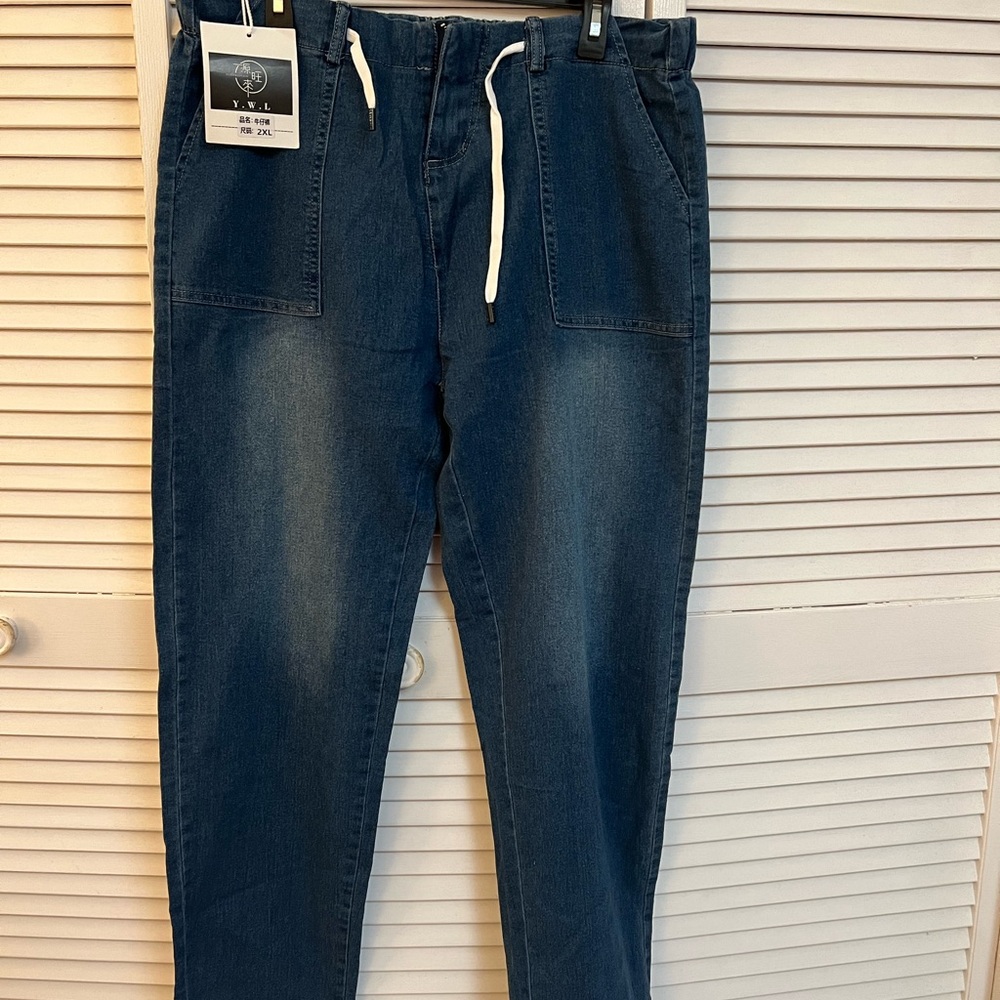 Brand new women’s blue jeans. Straight leg.